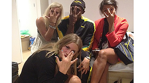 Usain Bolt celebrates 100m gold with Swedish women's handball team