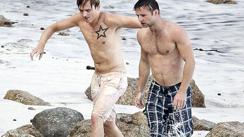 Harry Judd show off their six packs